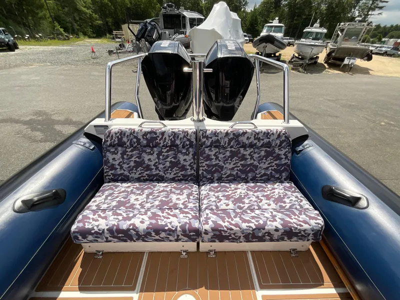 Slide: The Image of 2019 Protector 310 Chase boat with camo seats and dual Mercury engines. - 28