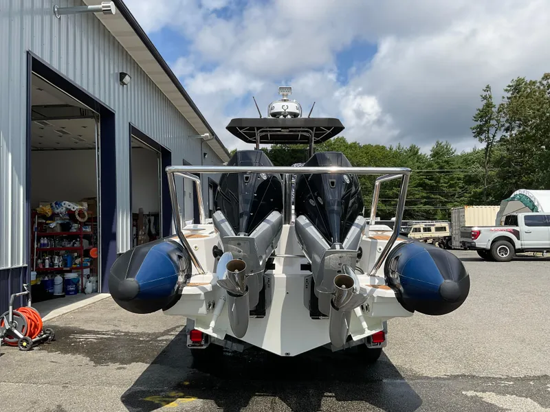 Slide: The Image of 2019 Protector 310 Chase boat with dual engines at a marina. - 3