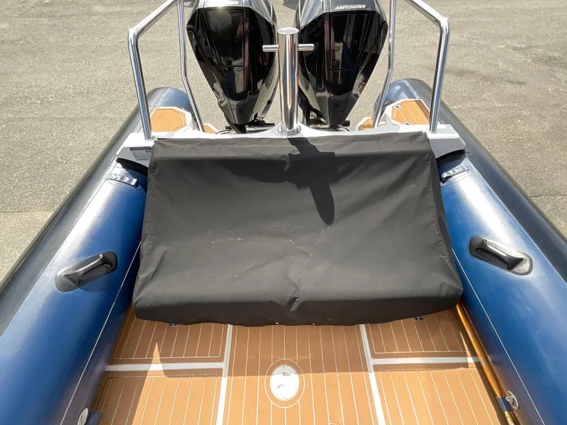 Slide: The Image of 2019 Protector 310 Chase boat with dual Mercury engines and teak deck. - 31
