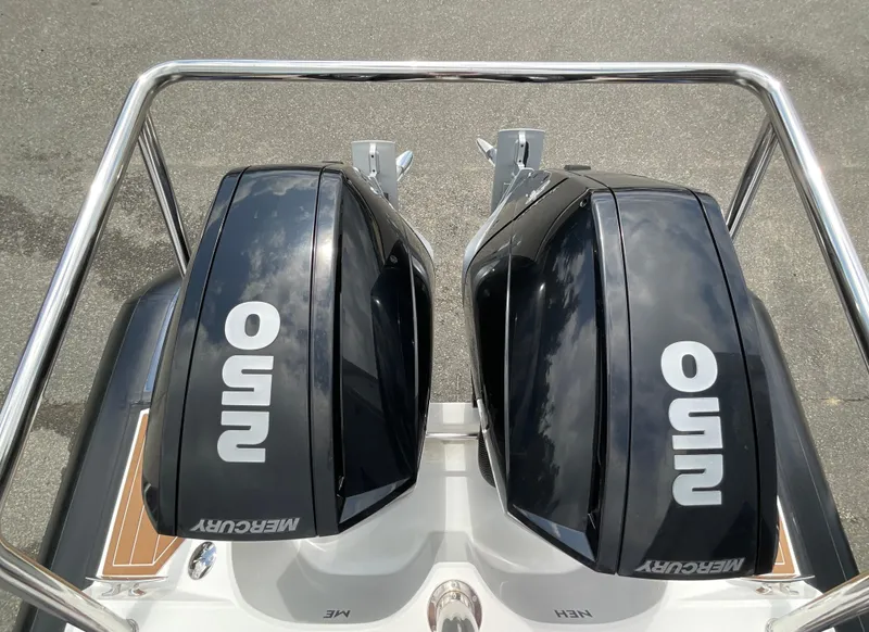 Slide: The Image of Twin Mercury outboard engines on a 2019 Protector 310 Chase boat, viewed from above. - 37