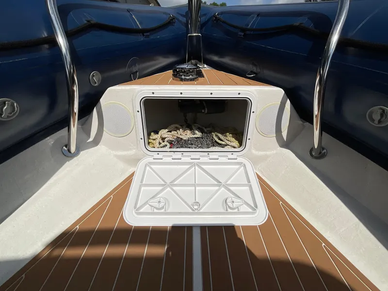 Slide: The Image of Open storage compartment on 2019 Protector 310 Chase boat with ropes inside. - 7