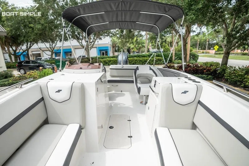 Slide: The Image of 2025 Starcraft SVX 231 OB DH boat interior with seating and canopy. - 11