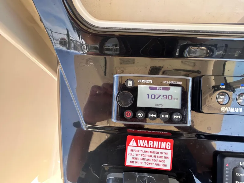 Slide: The Image of Control panel of a 2018 Scout 275 LXF boat with Fusion MS-NRX300 radio. - 14