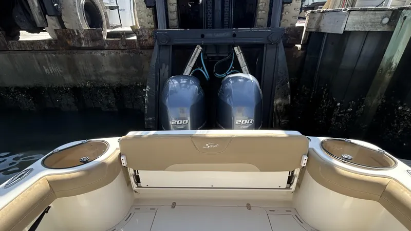 Slide: The Image of 2018 Scout 275 LXF boat with dual 200 horsepower engines at dockside. - 5