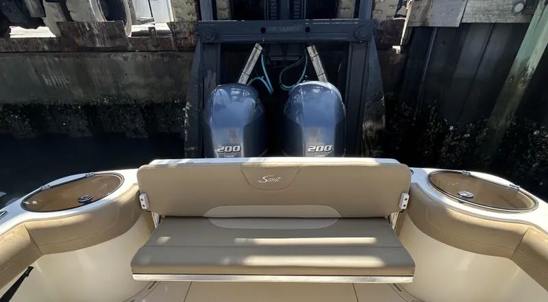 Slide: The Image of 2018 Scout 275 LXF boat with twin 200 horsepower engines at dock. - 6