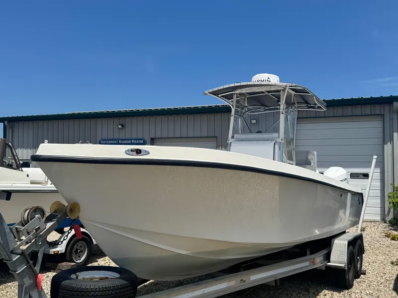 Slide: The Image of 1999 SeaVee 260B boat on trailer at Outermost Harbor Marine, clear blue sky. - 3