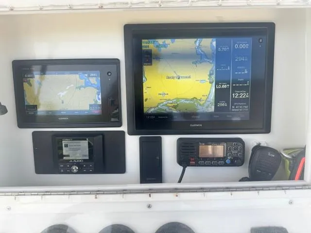 Slide: The Image of 1999 SeaVee 260B boat dashboard with Garmin navigation and communication equipment. - 8