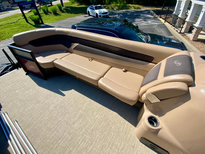 Slide: The Image of 2022 Barletta C24UC pontoon boat with luxurious tan seating and modern design. - 8
