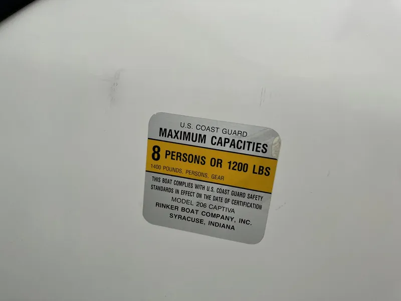 Slide: The Image of 1989 Rinker 206 Open Bow capacity label: 8 persons or 1200 lbs maximum. - 18