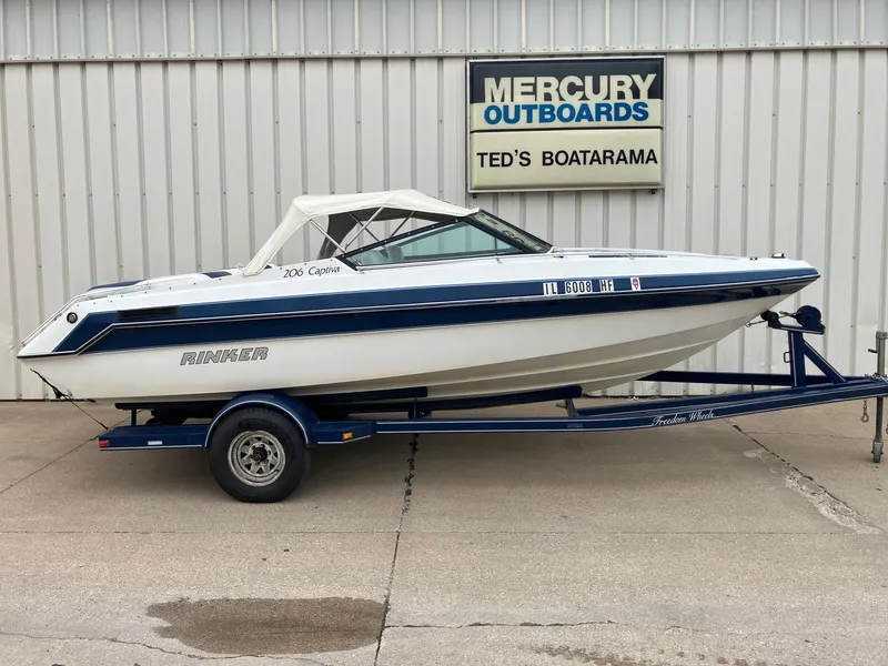 Slide: The Image of 1989 Rinker 206 Open Bow boat on trailer at Ted's Boatarama. - 2