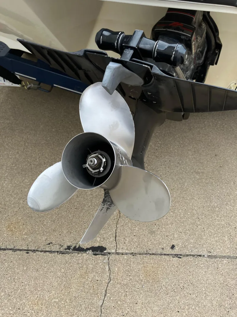 Slide: The Image of Propeller of a 1989 Rinker 206 Open Bow boat on concrete surface. - 22