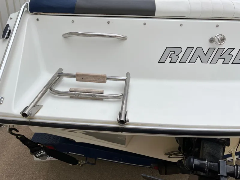Slide: The Image of 1989 Rinker 206 Open Bow boat with stainless steel swim ladder and logo. - 23