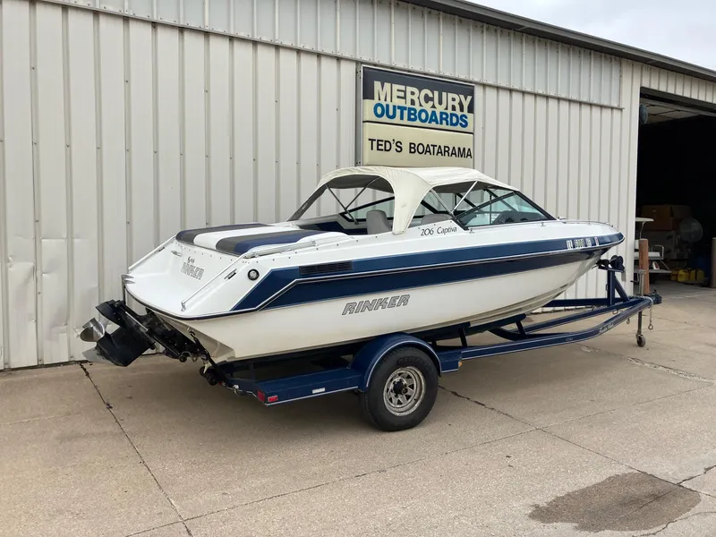 Slide: The Image of 1989 Rinker 206 Open Bow boat on trailer outside Mercury Outboards shop. - 4