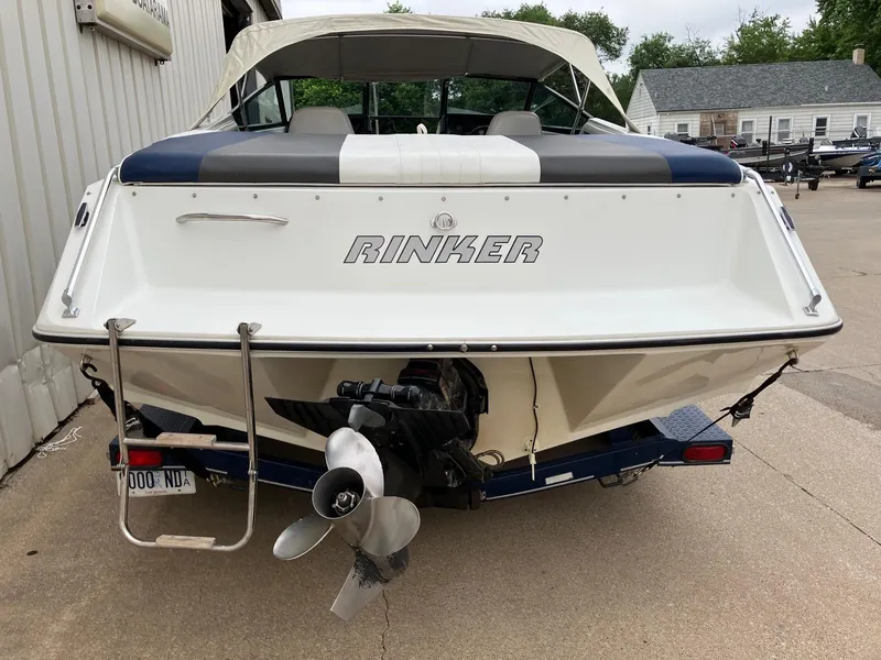 Slide: The Image of 1989 Rinker 206 Open Bow boat, rear view with propeller and ladder. - 6