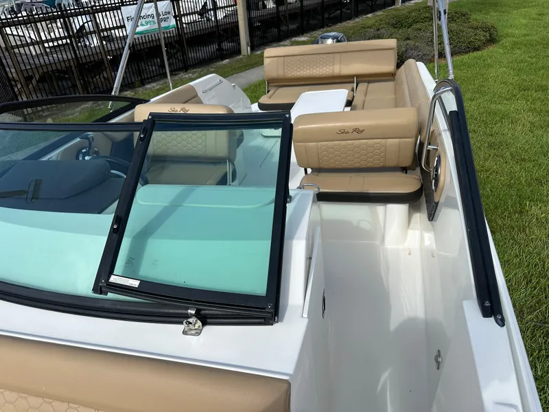 Slide: The Image of 2023 Sea Ray SDX 250 Outboard boat with tan seating and sleek design. - 11