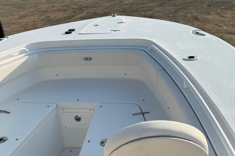 Slide: The Image of 2026 Sea Hunt Gamefish 28 boat interior, featuring spacious seating and storage compartments. - 4