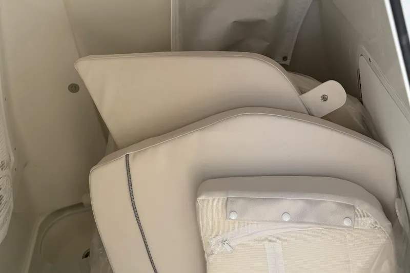 Slide: The Image of 2026 Sea Hunt Gamefish 28 interior with beige cushioned seating. - 8