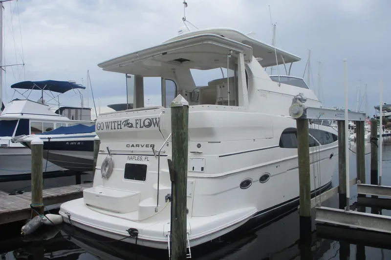 The Image of 2006 Carver 466 Motor Yacht docked in marina, Naples, FL. - 0