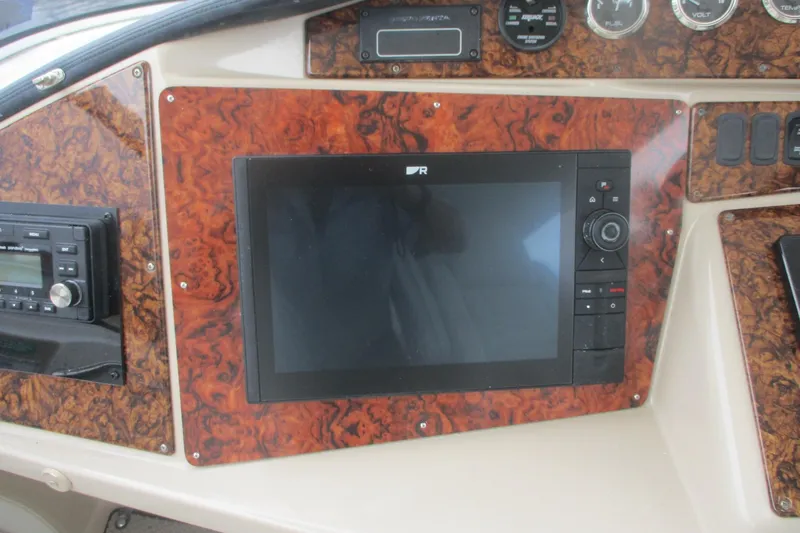 Slide: The Image of Dashboard of 2006 Carver 466 Motor Yacht with navigation and control systems. - 10