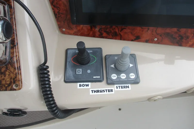 Slide: The Image of Control panel of 2006 Carver 466 Motor Yacht with bow and stern thruster joysticks. - 14