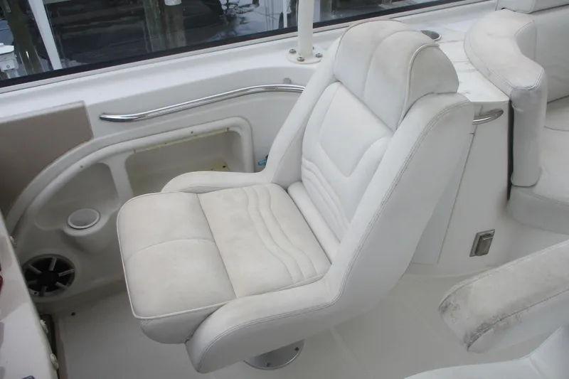 Slide: The Image of White captain's chair on 2006 Carver 466 Motor Yacht, featuring sleek design and comfortable seating. - 17