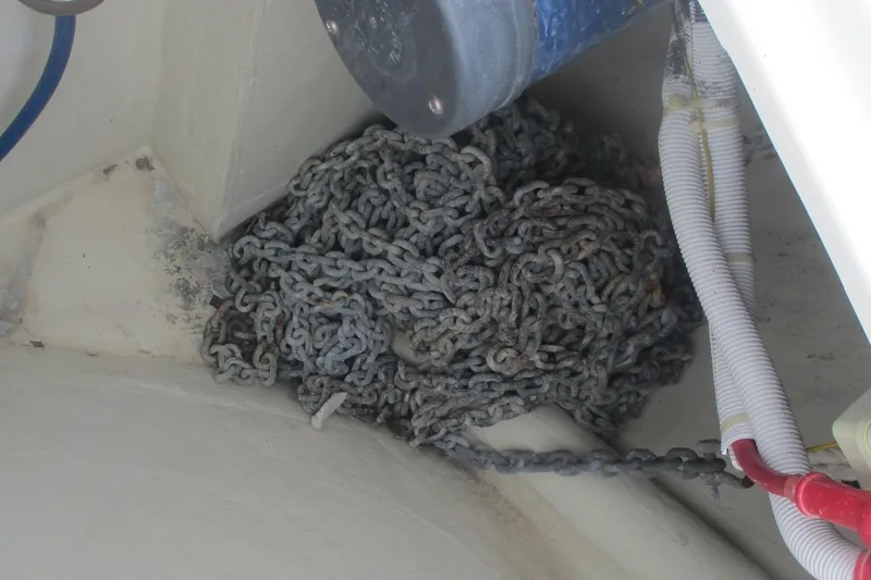 Slide: The Image of Coiled chain in a 2006 Carver 466 Motor Yacht's interior compartment. - 23