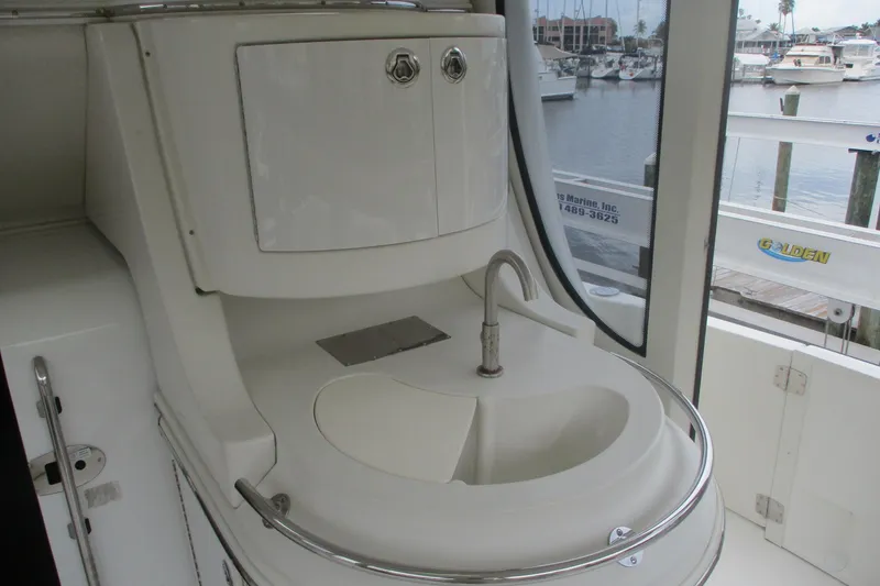 Slide: The Image of 2006 Carver 466 Motor Yacht sink area with marina view in background. - 26