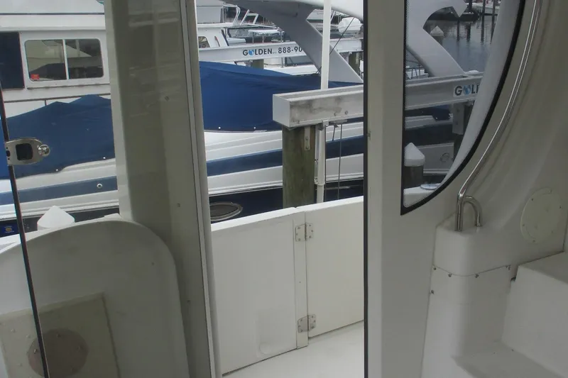 Slide: The Image of Interior view of a 2006 Carver 466 Motor Yacht, docked at a marina. - 31