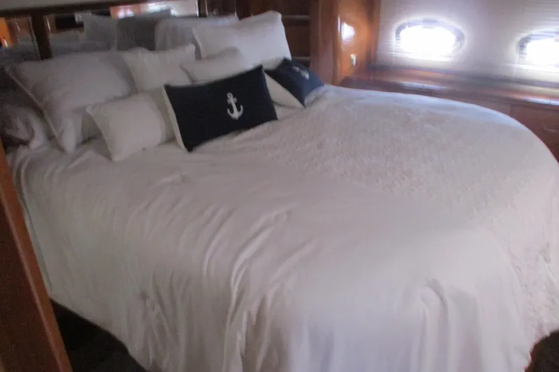 Slide: The Image of Luxurious bedroom in 2006 Carver 466 Motor Yacht with nautical-themed decor. - 51