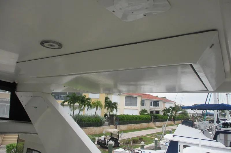 Slide: The Image of 2006 Carver 466 Motor Yacht interior view with marina backdrop. - 7