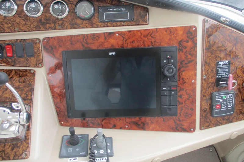 Slide: The Image of Control panel of 2006 Carver 466 Motor Yacht with navigation screen and gauges. - 12