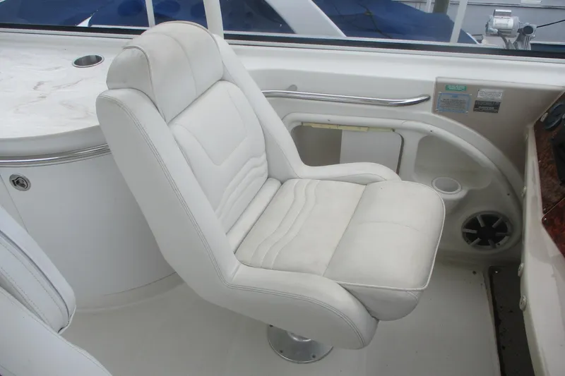 Slide: The Image of White captain's chair on 2006 Carver 466 Motor Yacht, featuring sleek design and comfortable seating. - 15