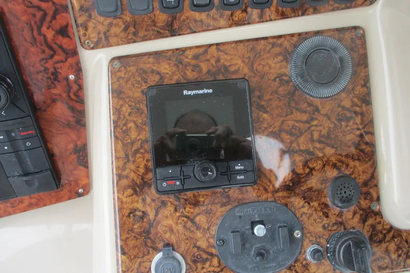 Slide: The Image of Control panel of 2006 Carver 466 Motor Yacht with Raymarine display and wood finish. - 18