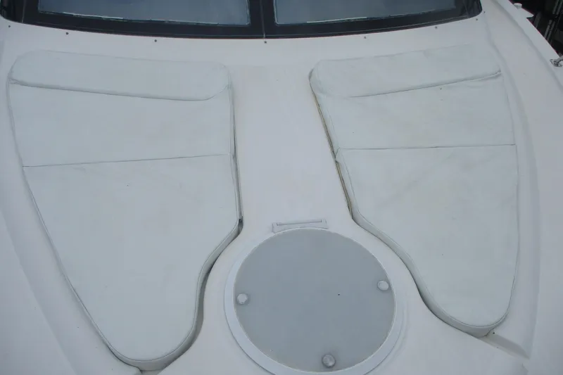 Slide: The Image of 2006 Carver 466 Motor Yacht deck with white cushioned seating. - 21