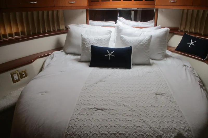 Slide: The Image of Luxurious bedroom interior of 2006 Carver 466 Motor Yacht with elegant bedding. - 32