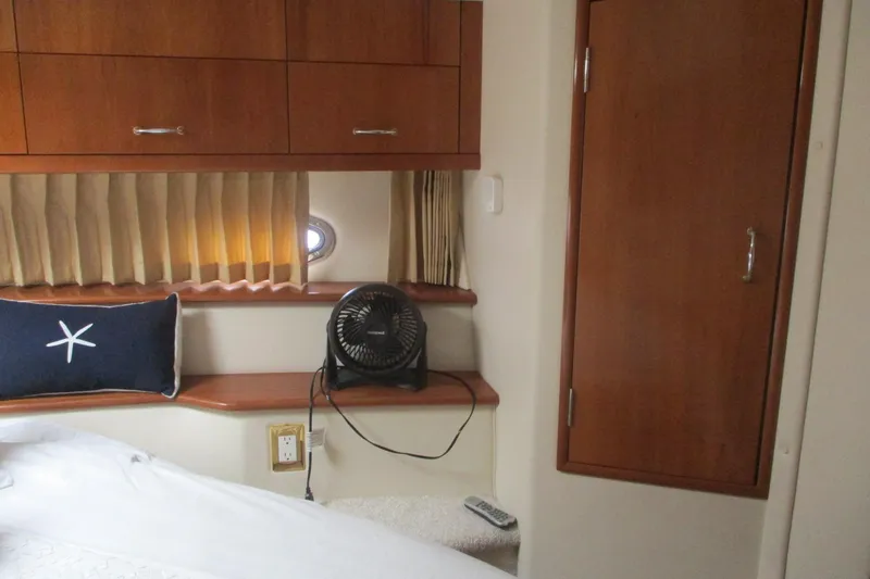 Slide: The Image of Interior cabin of 2006 Carver 466 Motor Yacht with wooden cabinetry and nautical decor. - 34