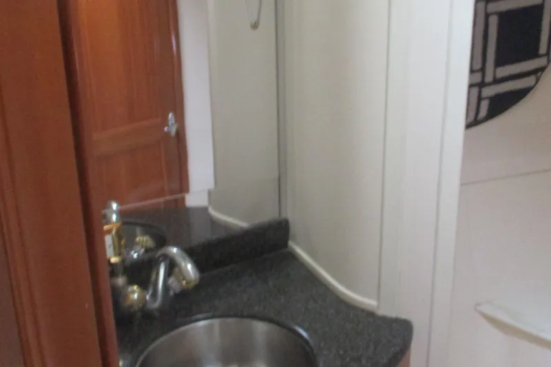 Slide: The Image of Bathroom interior of 2006 Carver 466 Motor Yacht with sink and mirror. - 35
