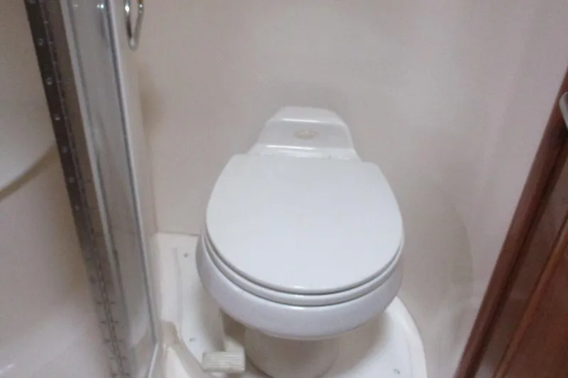 Slide: The Image of Toilet in 2006 Carver 466 Motor Yacht bathroom, next to shower enclosure. - 36