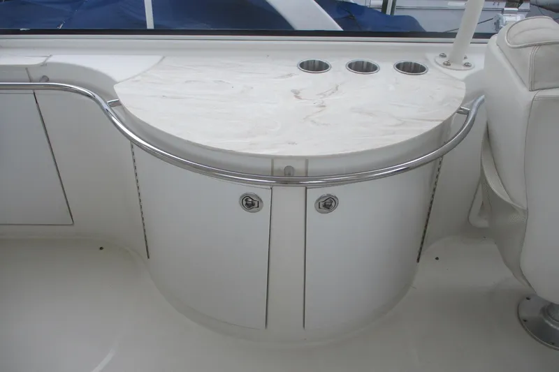 Slide: The Image of 2006 Carver 466 Motor Yacht interior with curved cabinet and marble countertop. - 4