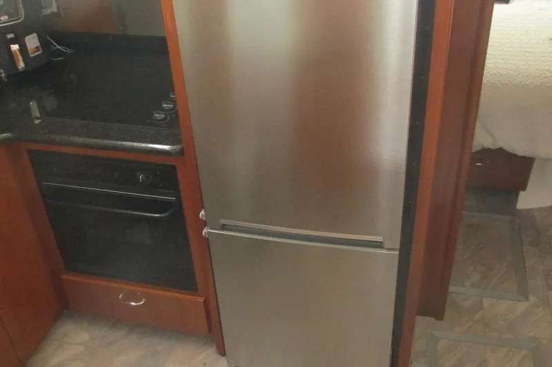 Slide: The Image of Kitchen area in 2006 Carver 466 Motor Yacht with stainless steel appliances. - 43