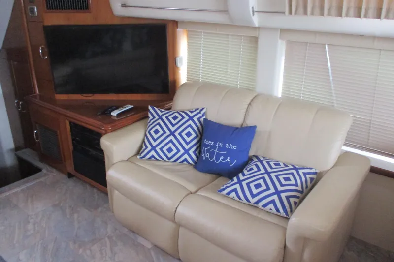 Slide: The Image of Interior of 2006 Carver 466 Motor Yacht with beige sofa and decorative pillows. - 46