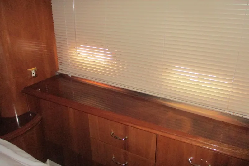 Slide: The Image of Interior of 2006 Carver 466 Motor Yacht with wooden cabinetry and blinds. - 53