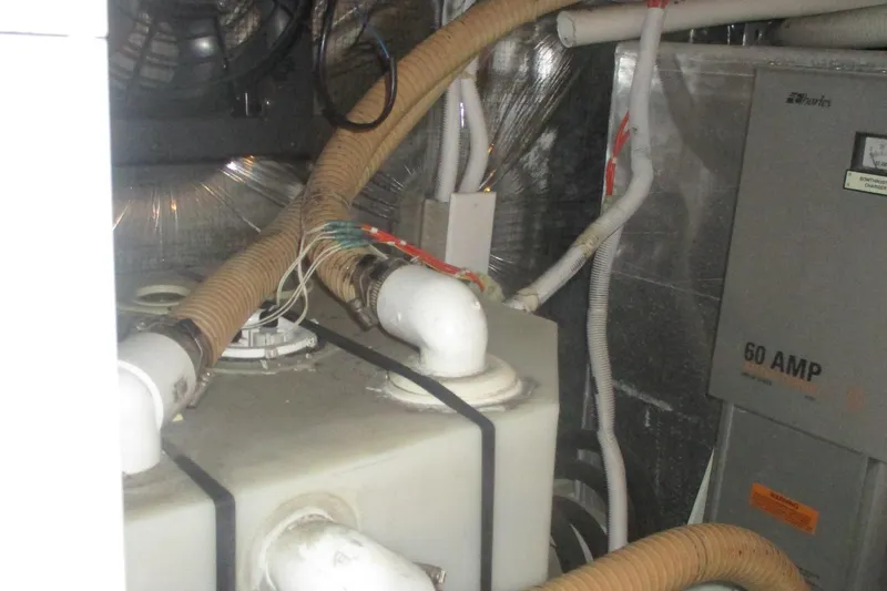 Slide: The Image of Engine room of 2006 Carver 466 Motor Yacht with wiring and ventilation. - 63