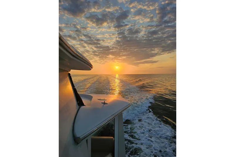 Slide: The Image of 2006 Carver 466 Motor Yacht cruising at sunset on open water. - 67