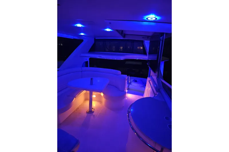 Slide: The Image of Luxurious 2006 Carver 466 Motor Yacht interior with ambient blue lighting. - 69