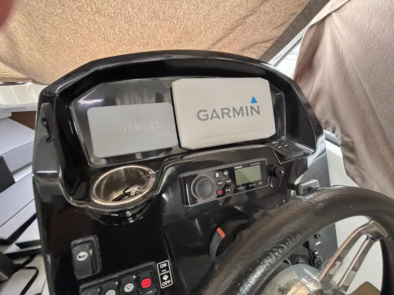 Slide: The Image of 2019 Jeanneau NC 795 helm with Yamaha and Garmin displays. - 13