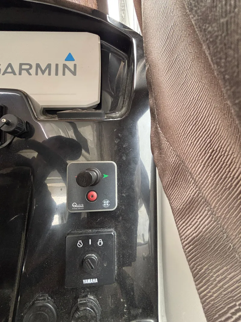 Slide: The Image of Control panel of a 2019 Jeanneau NC 795 boat with Garmin and Yamaha equipment. - 7