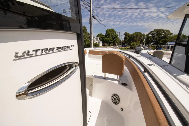 Slide: The Image of 2026 Sea Hunt Ultra 265 SE boat, showcasing sleek design and luxurious seating. - 4