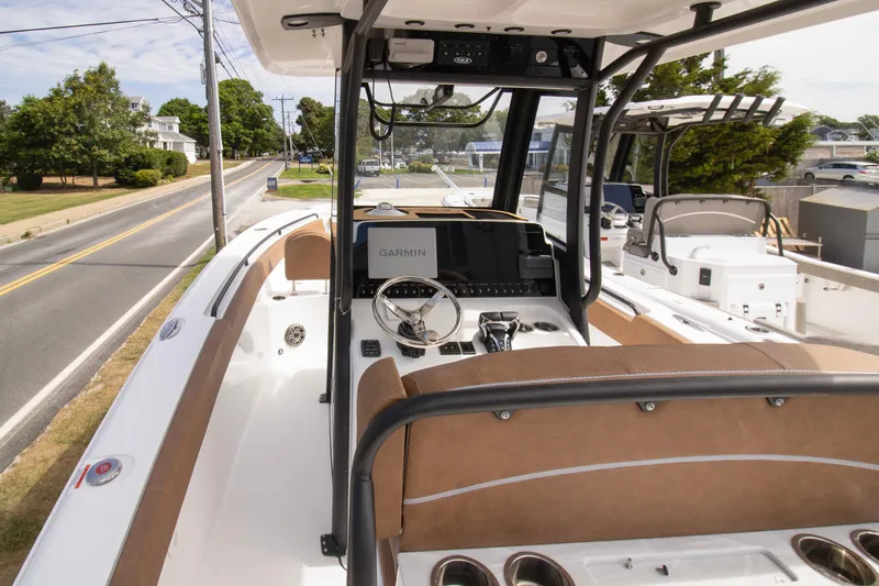 Slide: The Image of 2026 Sea Hunt Ultra 265 SE boat interior with Garmin navigation system and sleek design. - 5