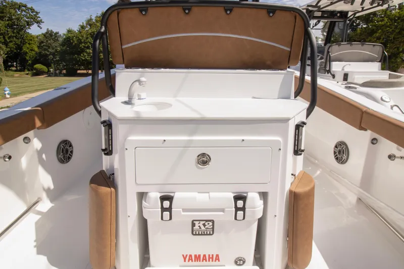 Slide: The Image of 2026 Sea Hunt Ultra 265 SE boat interior with sink and storage. - 6